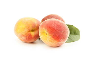 Fresh peaches fruit isolated on a white