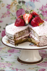 Сake with cream and strawberries