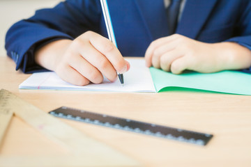 Desktop background of student sitting at desk for classwork