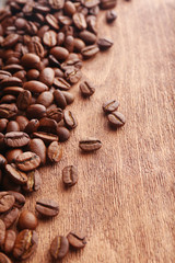 Coffee beans on wooden background