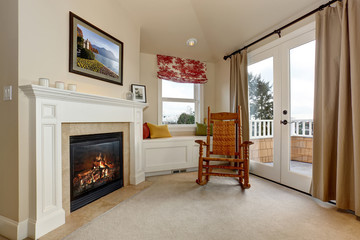 Corner of luxury bedroom with fireplace.