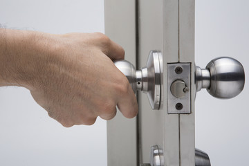 Naklejka premium Door knobs, aluminum door white background.