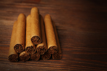 Cigars on wooden background