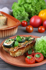 Casserole with vegetable mallow on wooden table, closeup
