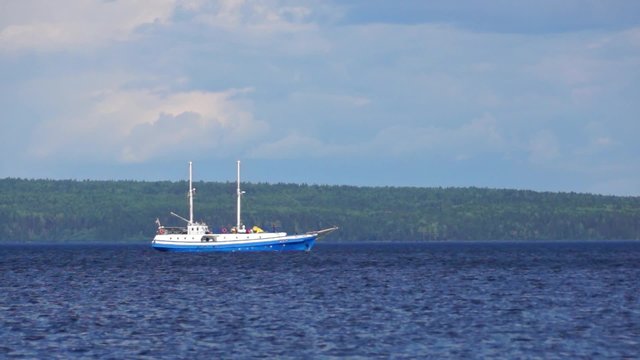 Vessel floats on summer lake