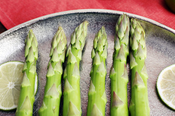 Fresh asparagus on pan, close-up