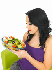 Young Woman Eating a Fresh Crisp Mixed Garden Salad