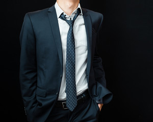 man in suit on a black background