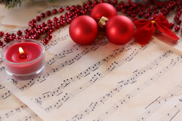Christmas decorations on music sheets background