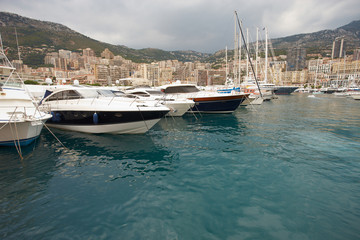 Fototapeta na wymiar Monaco, Monte-Carlo, 29.05.2008: Port Hercule, View from water, luxury yachts in harbor of Monaco, Etats-Uni, Piscine, Hirondelle