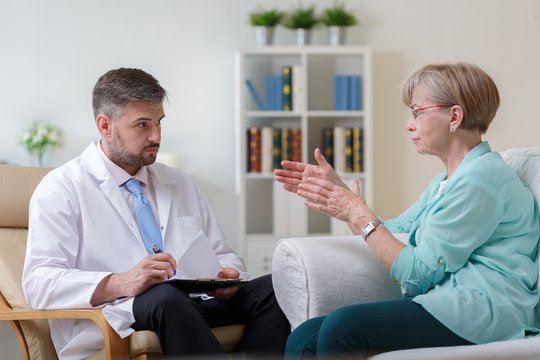 Psychiatrist listening his female patient