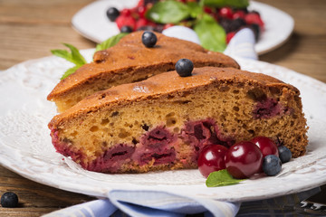Homemade cake with cherries and blueberries