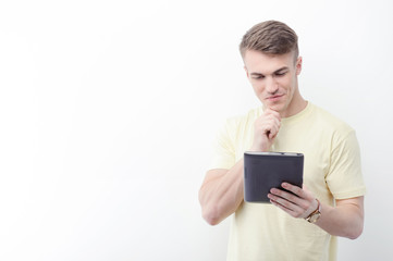 Handsome man with tablet on isolated background 