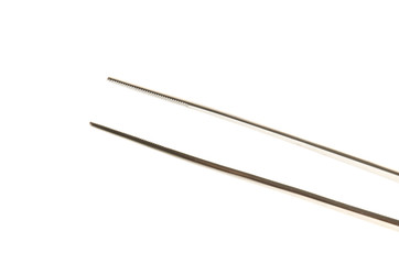 metal tweezers isolated over the white background