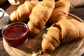 Delicious croissants on table close-up