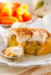 Pumpkin cinnamon rolls with spices and sweet cream