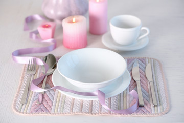 Beautiful holiday table setting in pink color