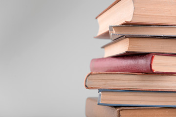 Heap of books on grey background