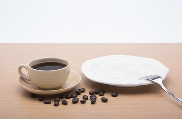 cup of coffee and delicious cake on white background