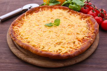 Cheese pizza with vegetables on table close up