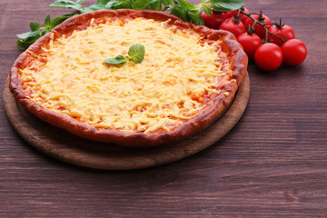 Cheese pizza with cherry tomatoes on table close up