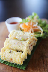 Spring roll on wood background