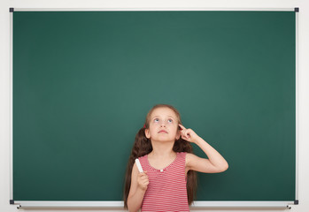 girl write on the school board