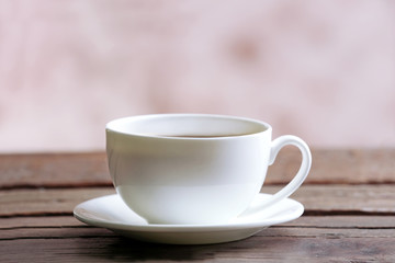 Cup of coffee on blurred background