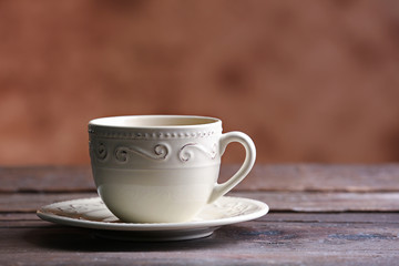 Cup of coffee on blurred background