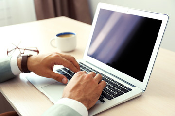 Man working with laptop in office