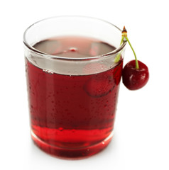 Glass of fresh juice with cherries isolated on white