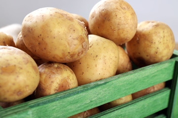 Young potatoes in crate close up
