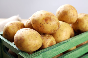 Young potatoes in crate close up