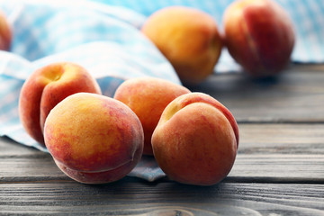 Sweet ripe peaches on table close up