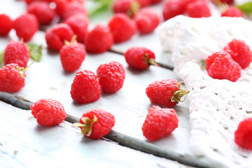 Fresh raspberries on wooden table, closeup