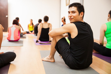 Attractive man in yoga class