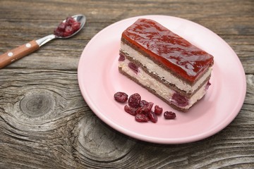 Cherry cake on old wooden table