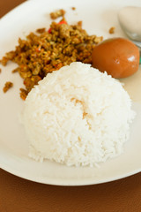 Thai food, Rices with Fried pork spicy with yellow curry and Kha