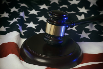 American legal law system concept image - gavel on flag