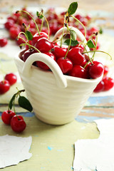 Fresh cherries on cracked wooden table, closeup