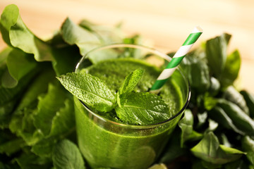 Green healthy juice with herbs close up