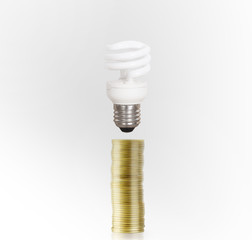 Bulb With Stack Of Coins