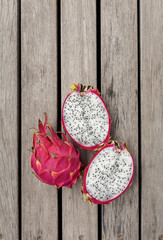 Dragon fruit with space on wooden floor vertical style