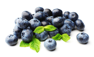 Fresh blueberries with mint leaves isolated on white