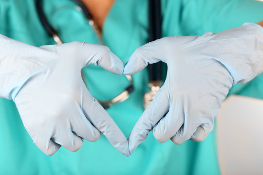 Doctor Hands In Gloves Making Shape Of Heart, Closeup