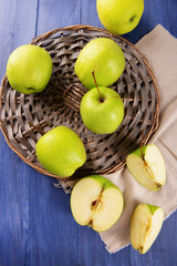 Sliced green apple on wooden table, top view