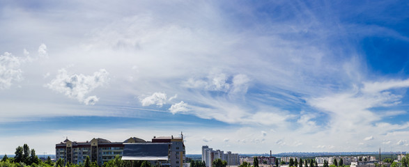 Sky with cirrus cloud against the backdrop of the city