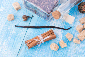 dry tea leaves cinnamon and on wooden background