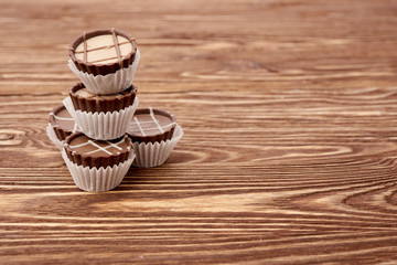 Dark chocolate on wooden background