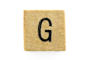 Wooden alphabet blocks with letters G